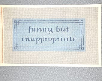 May include: A white canvas with a blue border and the text "funny, but inappropriate" in blue lettering.