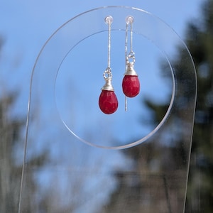 May include: A rustic wooden sign with the text "Welcome to our home" in white lettering. The sign features a distressed finish and a simple, inviting design, perfect for front door decor.