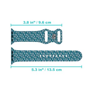 May include: A teal blue Apple Watch band with a white and grey pattern of small aeroplanes. The band is 9.6 cm long and 13.5 cm wide.