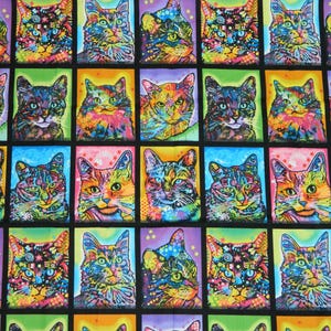 May include: A colourful fabric featuring a repeating pattern of cats. The cats are depicted in a psychedelic style with bright colours and swirling patterns. The fabric is ideal for quilting, crafts, and home decor.