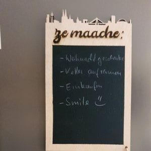 To Do List board with Cologne skyline as a fridge magnet