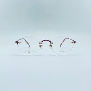 Shiseido SH-707 90s  Vintage Burgundy Titanium Oval  Rimless Unique Glasses  NOS Women & Men Frames ( New Old Stock ) Frame Japan