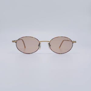 Óculos de sol ovais vintage: armação dourada Spicy Eyes dos anos 80, lentes marrons coloridas (NOS)