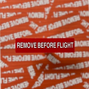 Remover antes do adesivo do voo