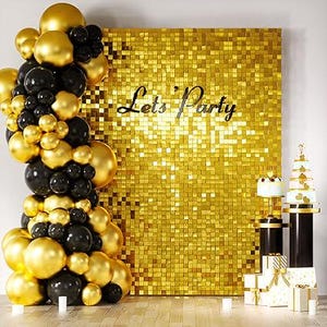 May include: A party scene with a gold sequin backdrop that reads "Let's Party". A balloon arch of gold and black balloons is on the left. Two cakes sit on black pedestals, and wrapped gifts are at the base.