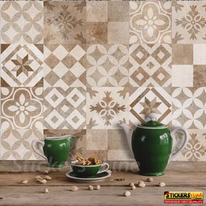 May include: A set of decorative tile stickers featuring a brown and white geometric pattern. The stickers are arranged in a grid pattern and are displayed on a countertop with a green teapot and creamer.
