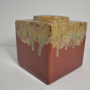 Square red vase with beautiful multi-colored drip