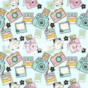 May include: A repeating pattern of cartoon cameras, instant photos, and flowers on a light blue background. The cameras are in shades of pink, peach, and teal. The photos depict landscapes and smiling faces.
