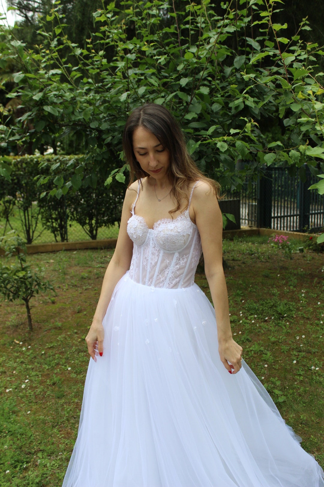 Lace Corset Wedding Dress with Spaghetti Straps and Crystal Details Lace Corset Wedding Dress with Spaghetti Straps and Crystal Details