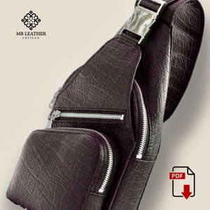 Peut inclure: Un sac &agrave; bandouli&egrave;re en cuir marron avec deux poches zipp&eacute;es et une boucle argent&eacute;e. Le sac est fabriqu&eacute; par MB Leather Artisan.