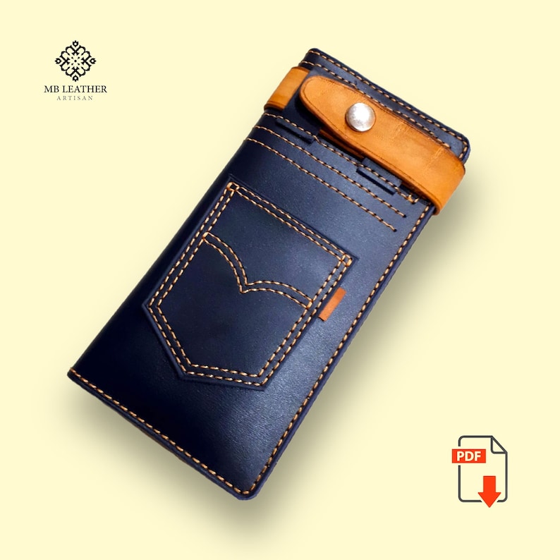 May include: A blue leather wallet with a brown leather strap and a denim pocket design. The wallet has a stitched detail around the edges and a metal button.