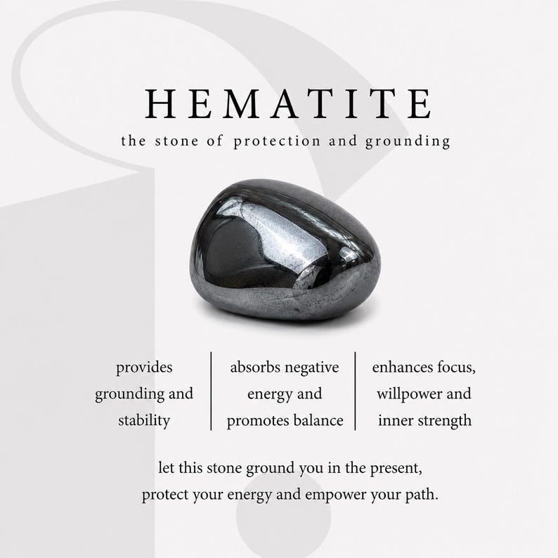 Puede incluir: Una piedra de hematita gris met&aacute;lica, lisa y pulida, centrada sobre un fondo blanco. El texto dice: HEMATITE, the stone of protection and grounding, provides grounding and stability, absorbs negative energy and promotes balance, enhances focus, willpower and inner strength, let this stone ground you in the present, protect your energy and empower your path.