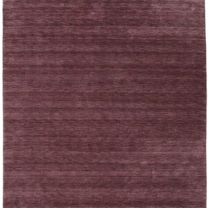 May include: A rectangular rug in a deep burgundy color. The rug has a textured appearance with horizontal lines running across its surface. The overall design is simple and modern, suitable for various interior styles.