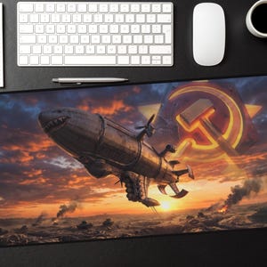May include: A large rectangular mouse pad featuring a steampunk airship with a shark-like mouth, set against a fiery sunset and a hammer and sickle emblem. The design includes a detailed sky and a war scene.