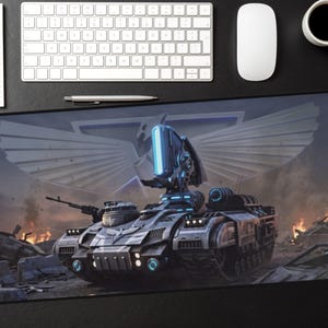 May include: A large rectangular mousepad featuring a futuristic tank design in shades of gray and blue, set against a backdrop of a war-torn landscape. The tank has detailed weaponry and glowing blue accents. A keyboard, mouse, and coffee cup are visible.
