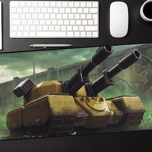May include: A yellow and black tank with two large black cannons on a mousepad. The mousepad features a green and gray background with a logo. A white keyboard, mouse, pen, notepad, and a cup of coffee are on the black surface.