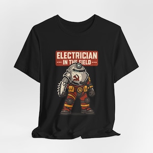 May include: Black t-shirt featuring a cartoon electrician in a red and yellow outfit, with a helmet and a wrench-like hand. The text "ELECTRICIAN --IN THE FIELD--" is displayed above the character in a red banner.