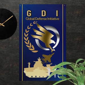 May include: A blue and gold banner with the text "GDI Global Defense Initiative". The banner features a silver circle with a gold eagle inside, surrounded by a gold laurel wreath. Below the circle is a gold silhouette of a military ship, a fighter jet, and a soldier.