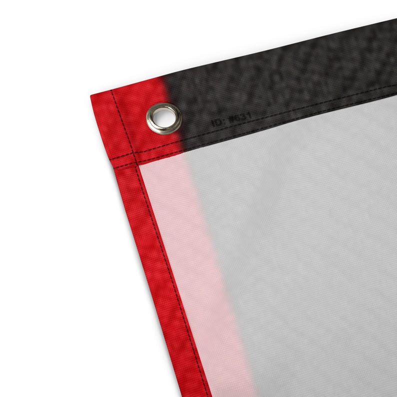 May include: Close-up of a flag with a red border and a black top edge. The flag has a white center with a red stripe. A metal grommet is visible in the upper left corner. The text "ID: #631" is printed on the flag.