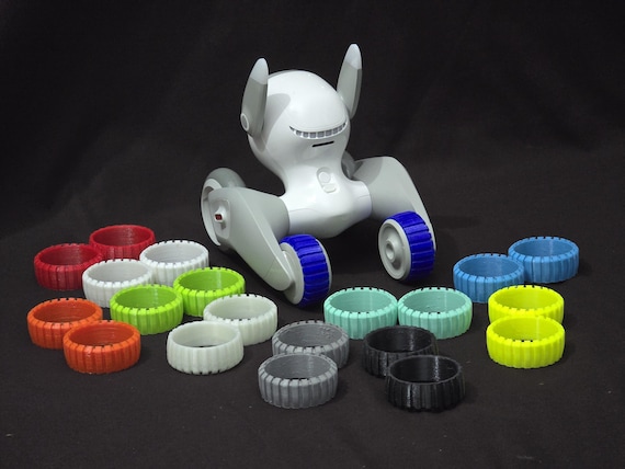 Micheloona: Back wheels/tires with treads for Loona Pet Robot to increase grip on uneven surfaces.