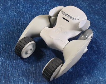 Micheloona: Back wheels/tires with treads for Loona Pet Robot to increase grip on uneven surfaces.