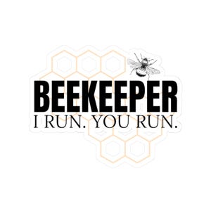 May include: A white sticker with the text "BEEKEEPER I RUN. YOU RUN." in black, featuring a detailed illustration of a bee and a honeycomb design in the background. The sticker is designed for beekeepers.