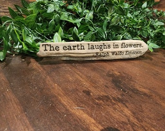 Ralph Waldo Emerson - The earth laughs in flowers.