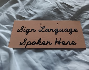 Sign Language spoken here, use of sign language, sign language in the home, American Sign Language, deafness, deaf culture, deaf community