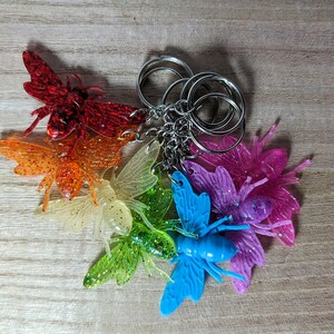 3D Bee Keychains - rainbow colored 3 dimensional cartoon style bumblebees with glitter and texture in any color you like