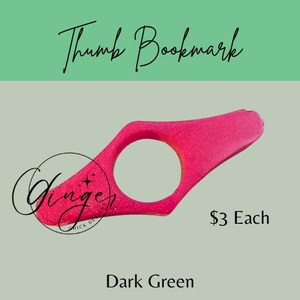 May include: A magenta thumb bookmark with a circular opening and a curved design. The text "Thumb Bookmark" is at the top, with "Ginger" and "Dark Green" at the bottom.