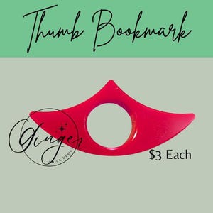 May include: A bright red thumb bookmark with a circular opening for the thumb. The bookmark has a curved design with pointed ends. The text "Thumb Bookmark" is written in cursive at the top.