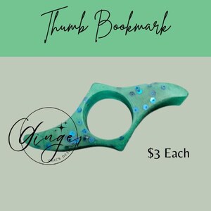 May include: A teal thumb bookmark with blue sequins. The bookmark has a circular opening for the thumb and a curved design. The text "Thumb Bookmark" is at the top, and the text "Ginger Chick Designs" is at the bottom.
