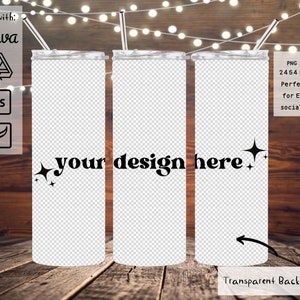 May include: Three stainless steel tumblers with a transparent background. The tumblers are on a wooden surface with string lights in the background. The text "your design here" is on the middle tumbler.