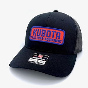 May include: Black trucker hat with a red and blue patch that says "Kubota Tractors-Equipment". The hat is adjustable and has a black mesh back.
