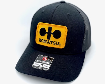 Vintage Komatsu Logo Retro Patch Sewn onto Richardson 112 Black on Black Trucker Hat Cap - Heavy Equipment Construction Mining