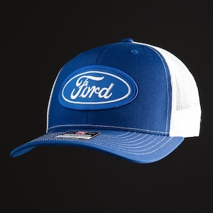 May include: A blue and white trucker hat with a white oval patch that says "Ford" in white lettering.