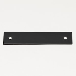 May include: Black metal rectangular bar with two holes.