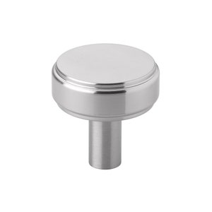 May include: A silver cabinet knob with a round, smooth top and a fluted base. The knob has a cylindrical stem.