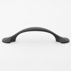 May include: Black arched cabinet pull with a smooth finish.