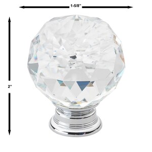 May include: A clear crystal cabinet knob with a faceted design and a chrome base. The knob measures 1-5/8 inches in diameter and 2 inches in height.