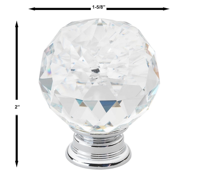 May include: A clear crystal cabinet knob with a faceted design and a chrome base. The knob measures 1-5/8 inches in diameter and 2 inches in height.