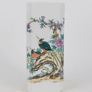 A folk collection of hand-painted ceramic pen holders
