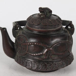 Hand-carved copper teapots from folk collections