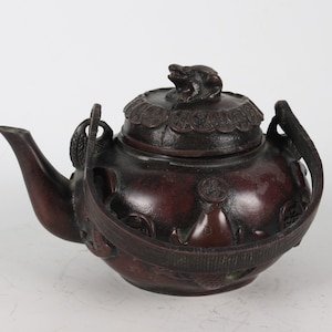Hand-carved copper teapots from folk collections