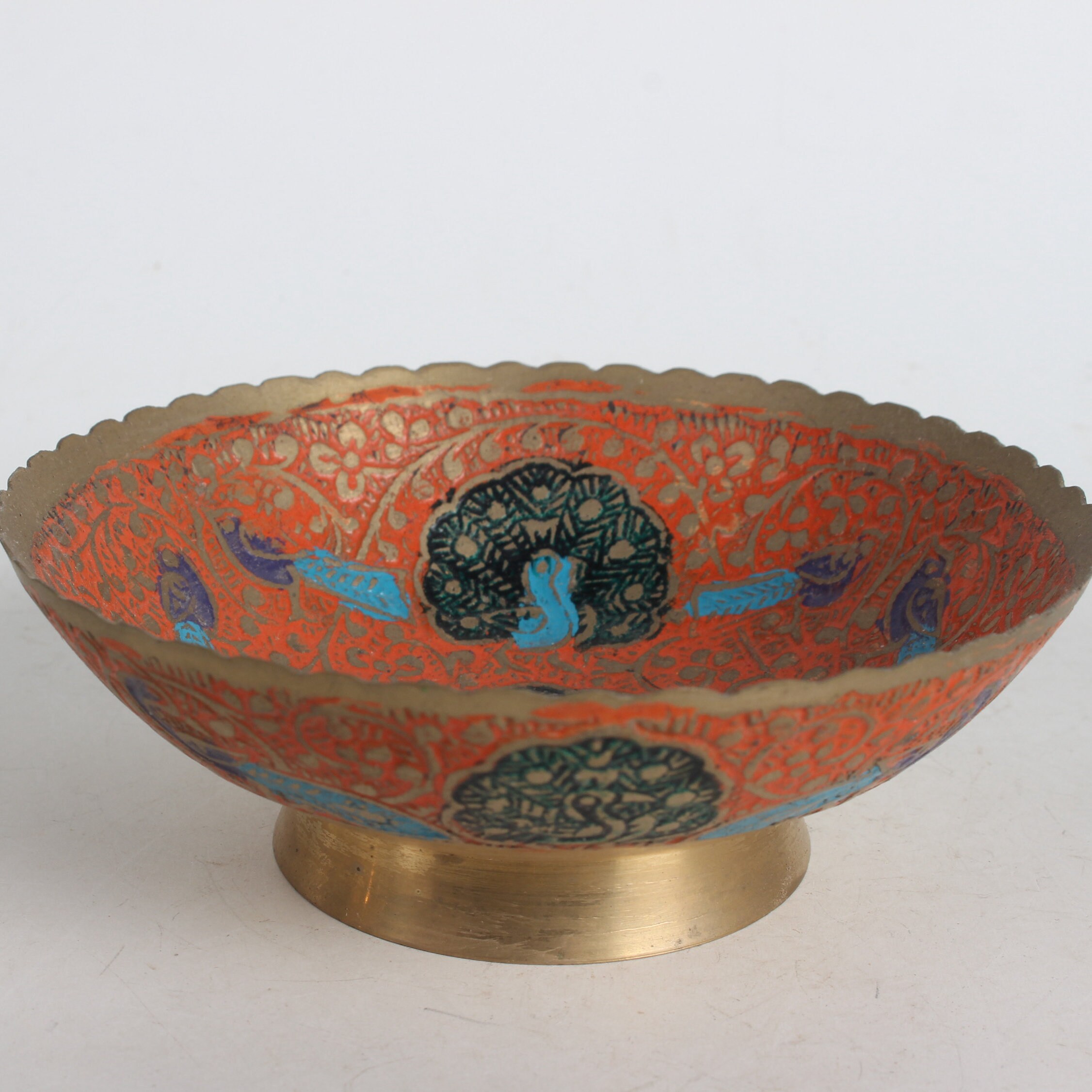 A folk collection of hand-painted brass bowls
