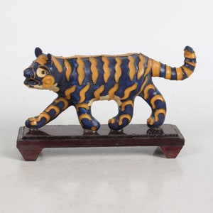 A folk collection of hand-painted cloisonne tiger statues