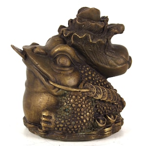 Folk collection of hand-carved brass golden toad statue