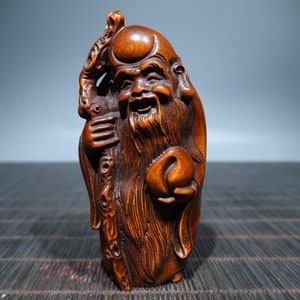 A folk collection of hand-carved boxwood  statues