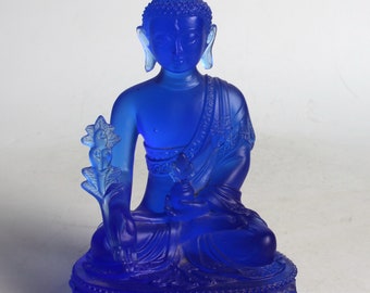 A folk collection of hand-carved glazed Buddha statues