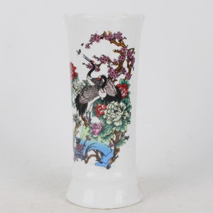 A folk collection of hand-painted ceramic pen holders